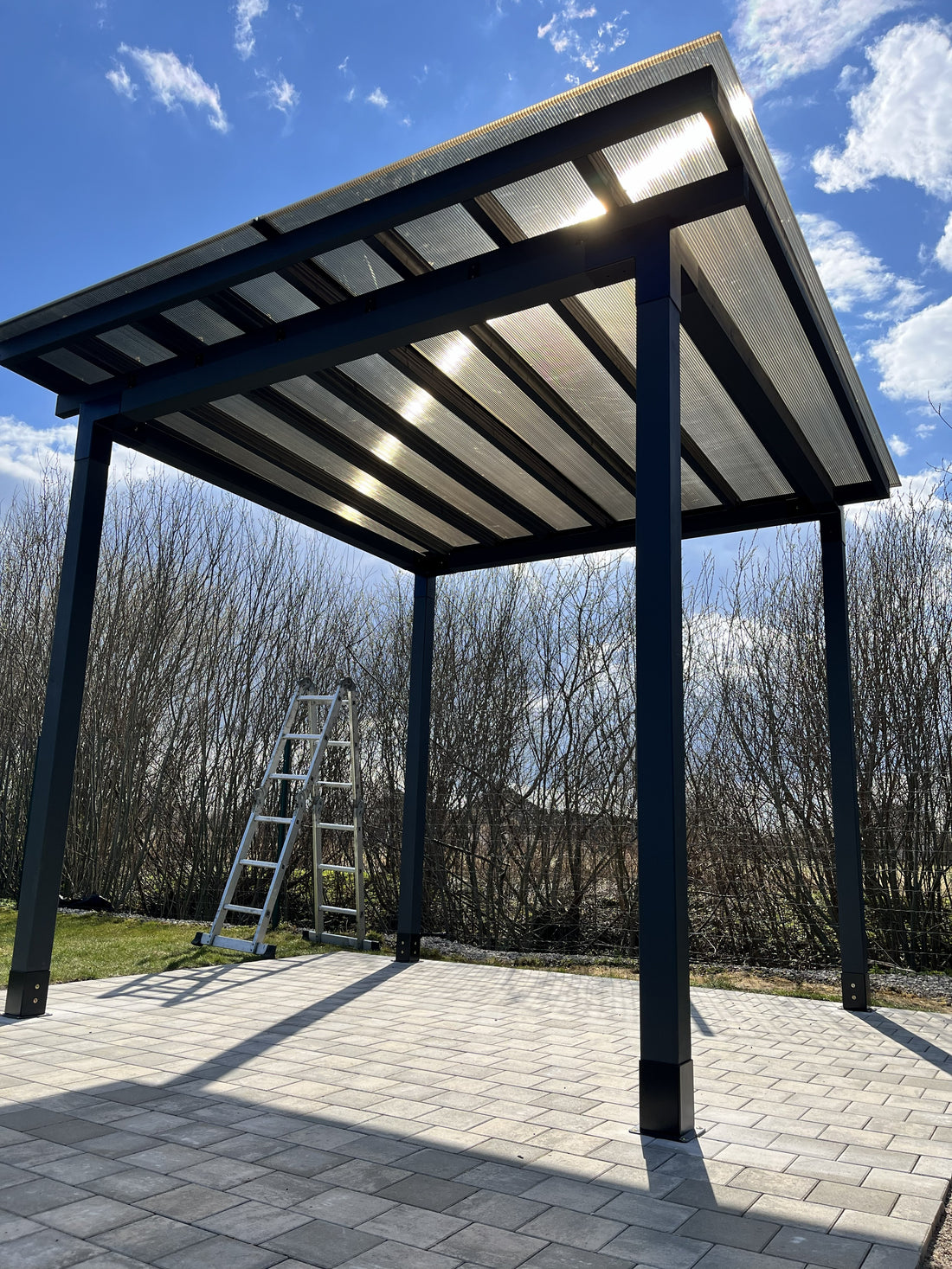 Modular canopy DIY by Terases, 3.5m x 3.5m, showing the assembled outdoor canopy with adjustable panels and sturdy frame.