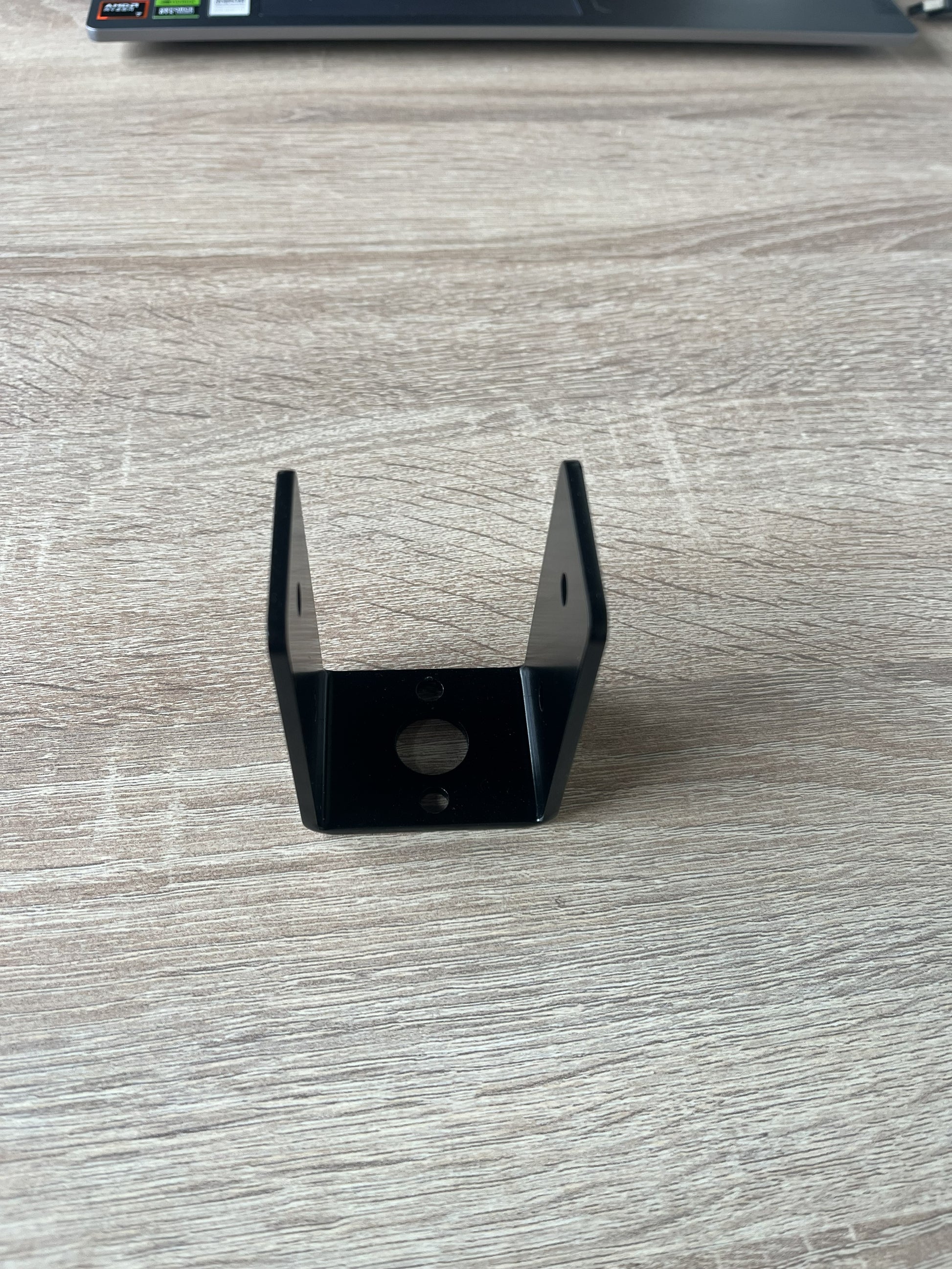 Terases beam in place support bracket for 45mm lumber, shown installed for sturdy beam support in construction projects.