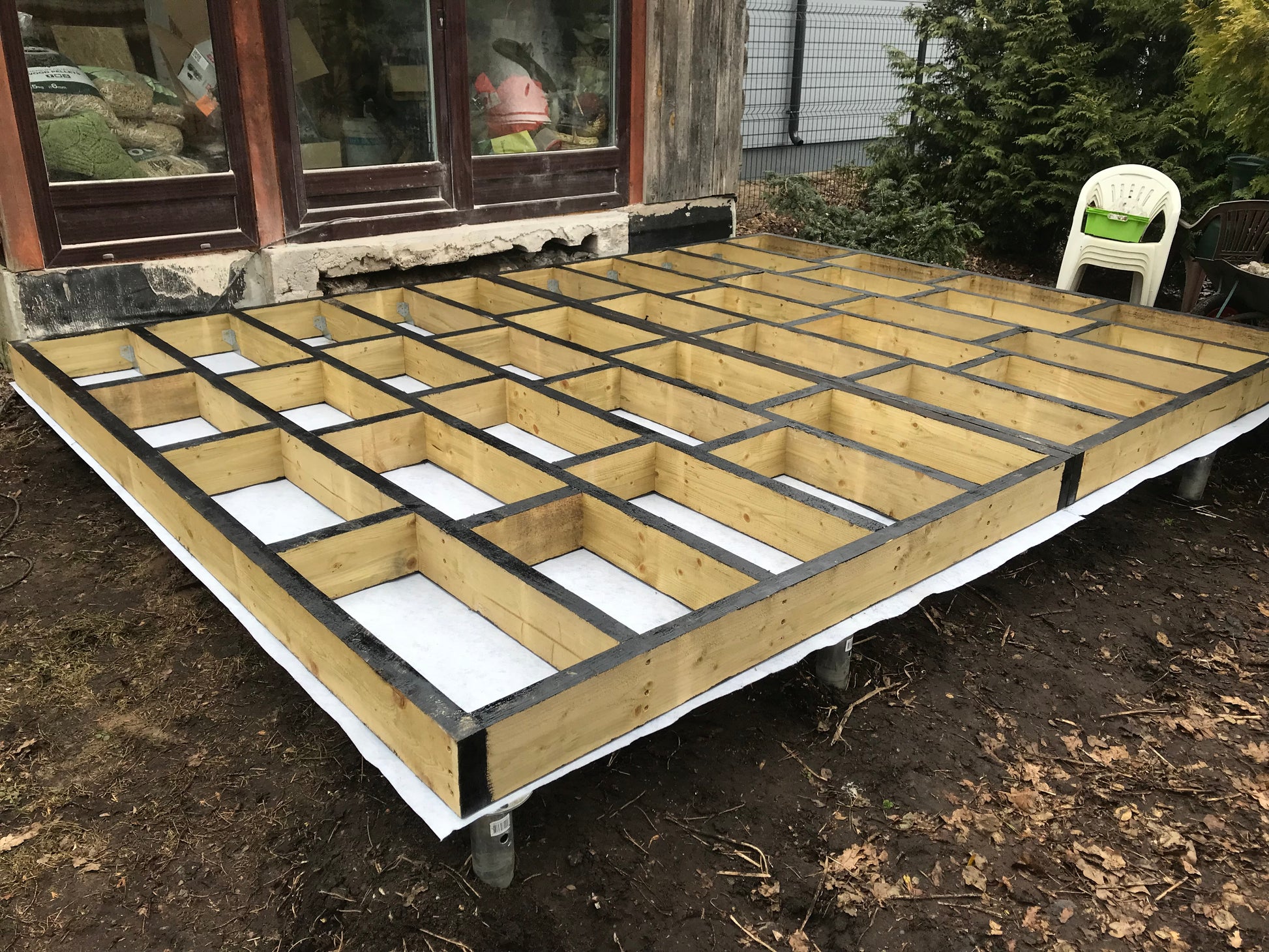 Wooden floor joist structure on a foundation outdoors