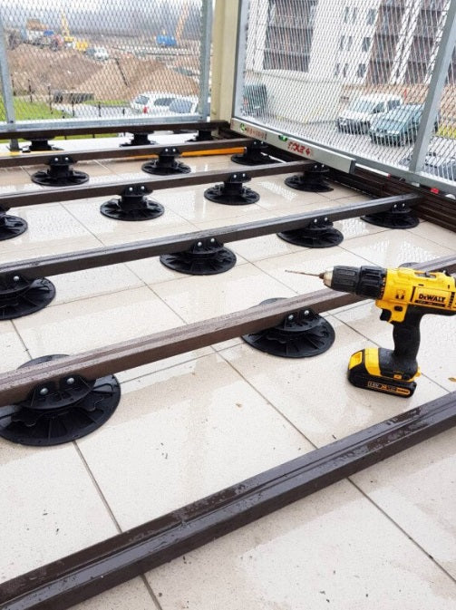 Adjustable patio support feet.